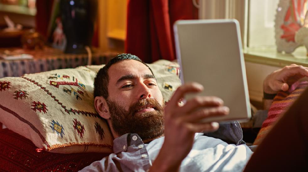 Man reading tablet